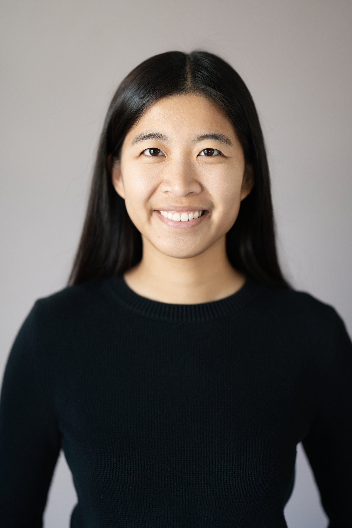Corporate headshot on a seamless studio backdrop