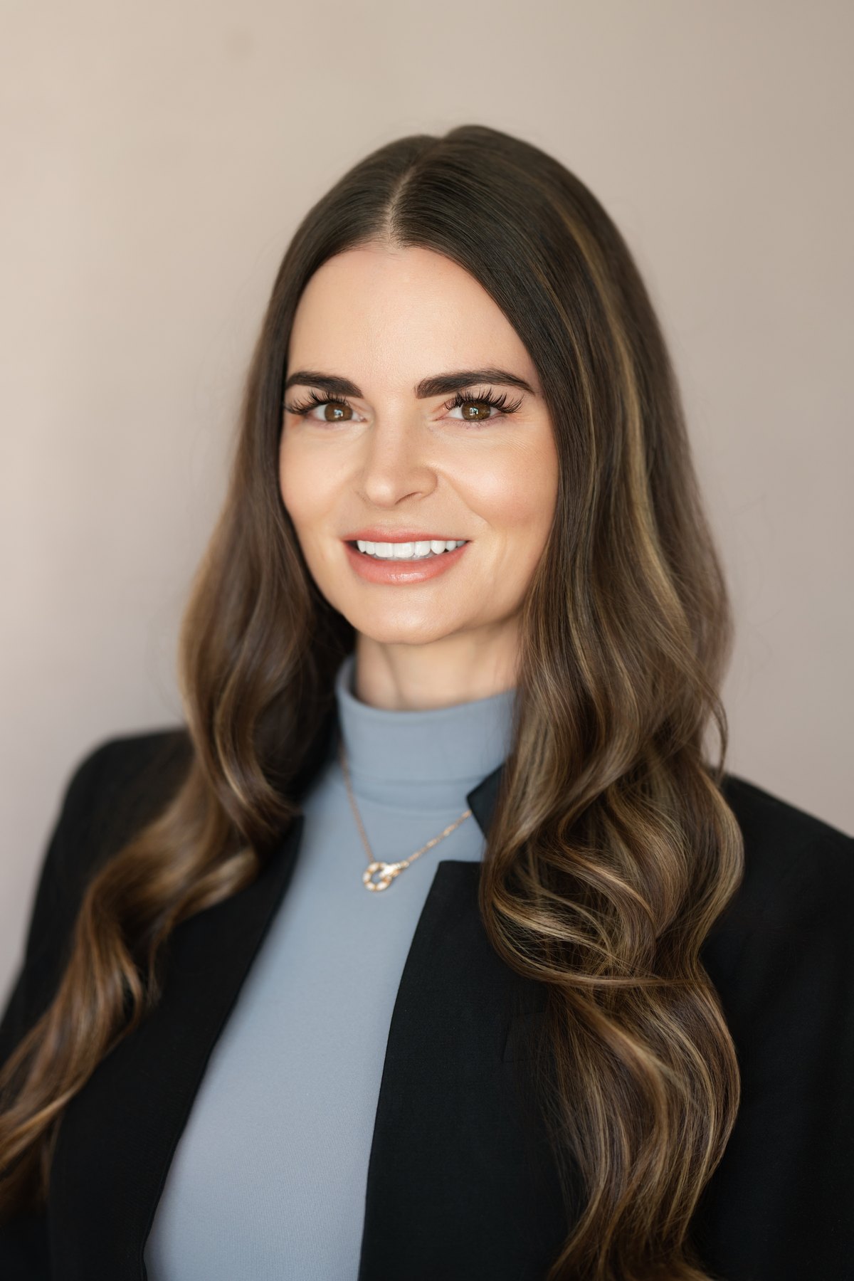 Corporate headshot on a colored seamless backdrop